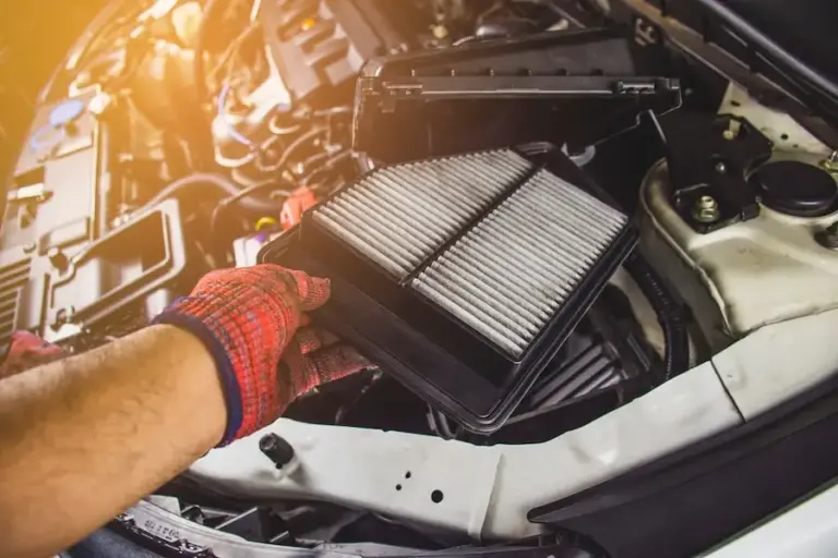 car-air-filter-hand-mechanic-man-is-installing-into-air-filter-socket-car-engine-automotive-part-concept_41472-407