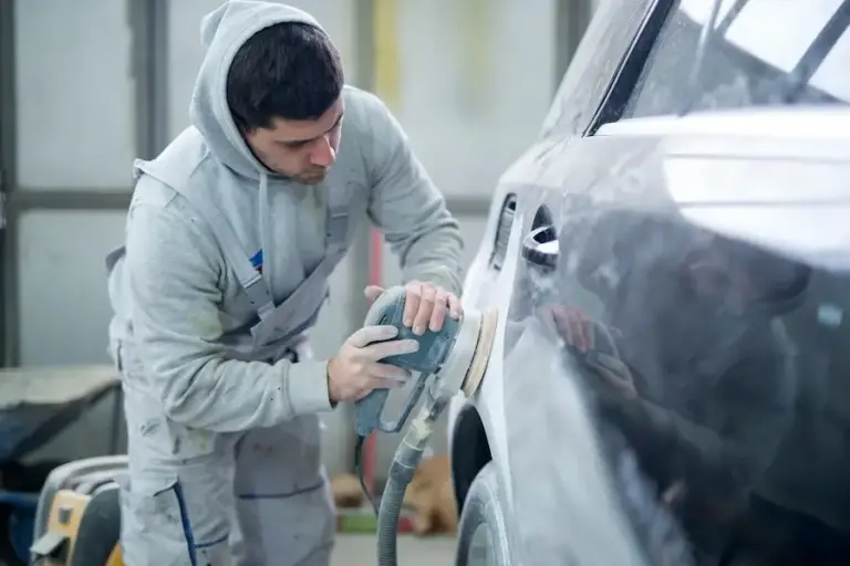 shot-professional-repairman-preparing-vehicle-new-paint_342744-794