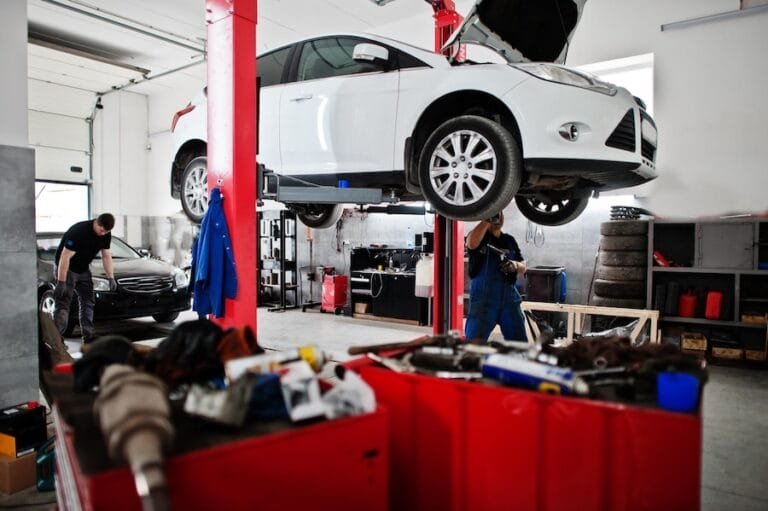 car-repair-maintenance-theme-mechanic-uniform-working-auto-service_627829-3918