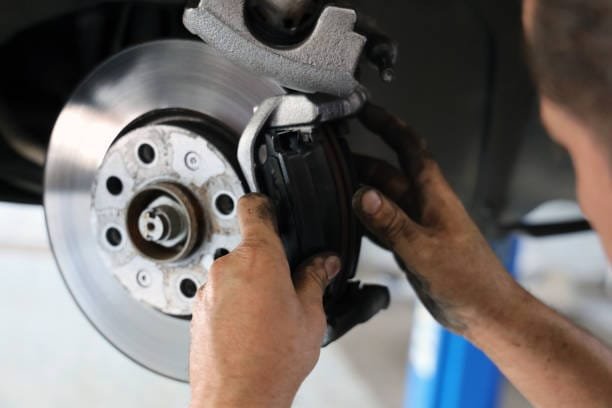 Brake pad replacement in car service